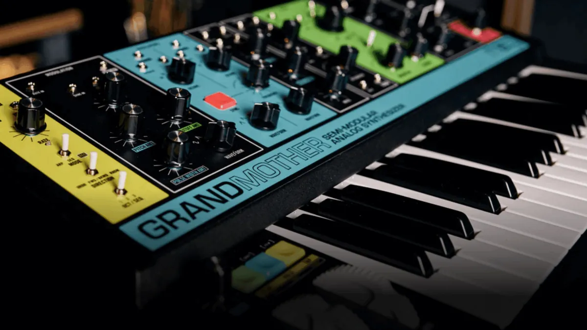 Angled view of a hardware synthesizer keyboard and control panel.