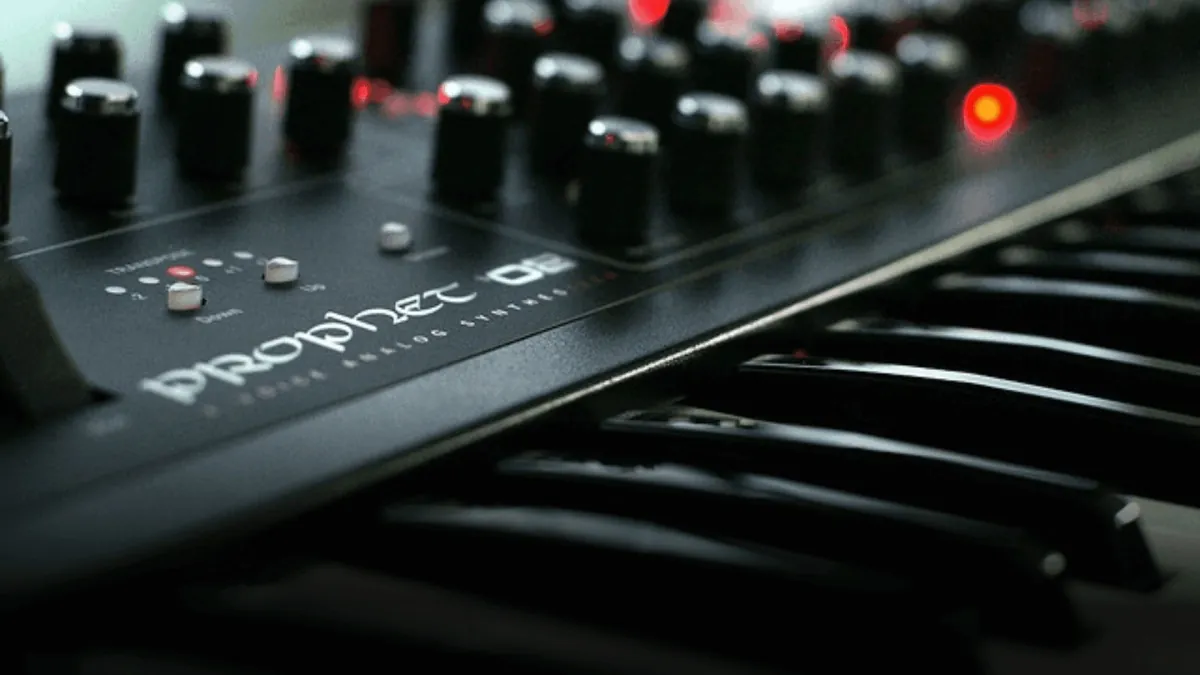 Close-up of synthesizer keys and rotary controls.